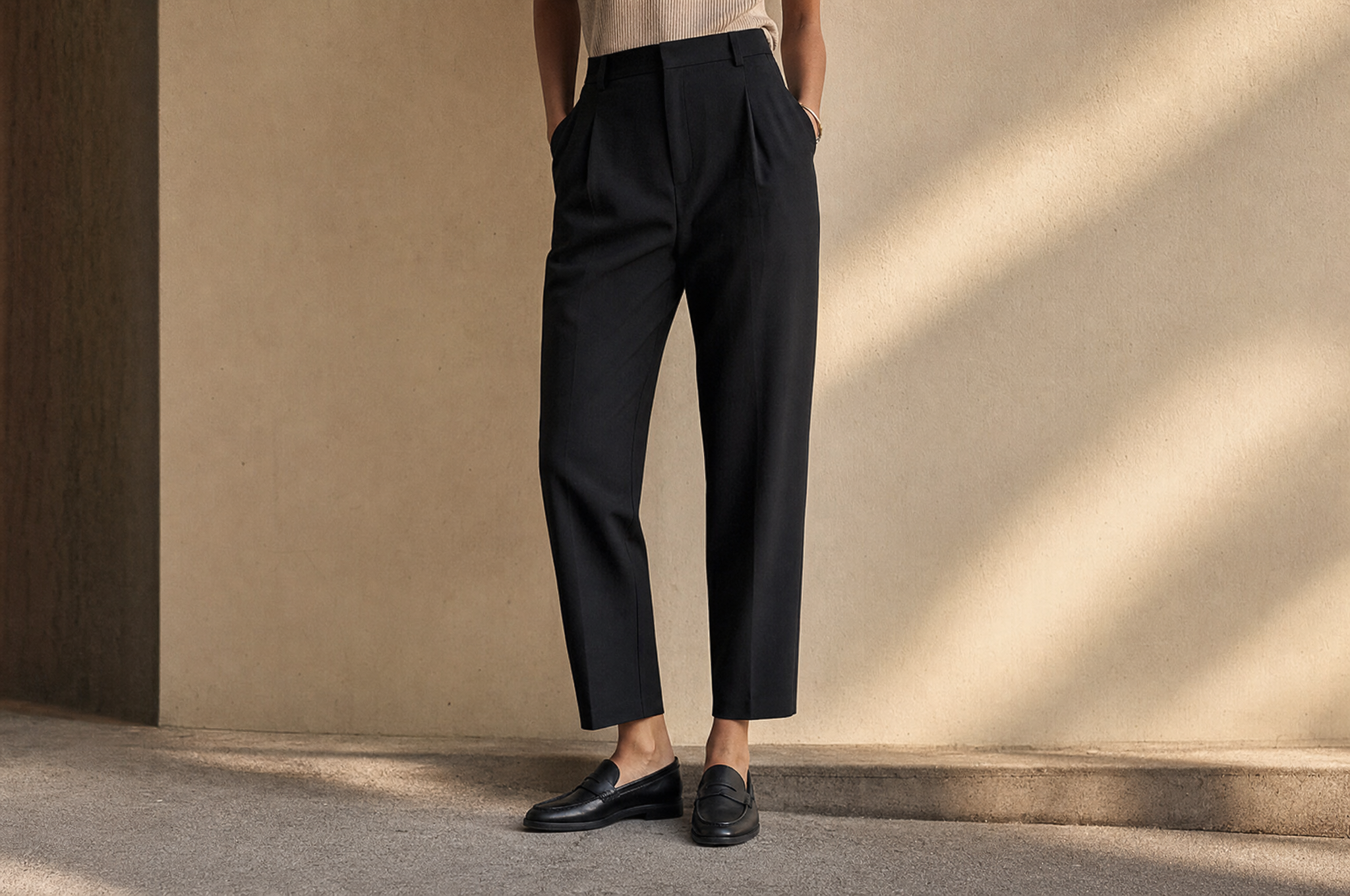 High-rise tapered black trousers with leather loafers
